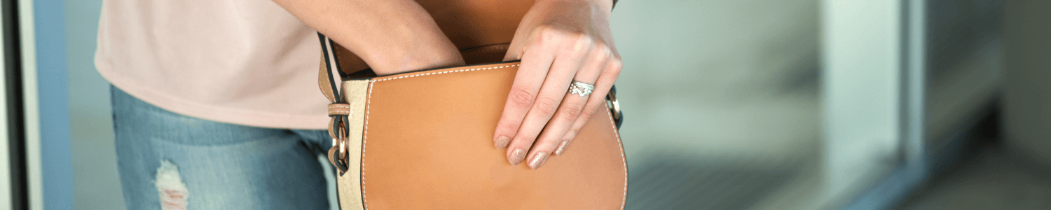 Portable contents insurance - hand reaching into a handbag